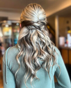 Blonde hair with elegant braided style.